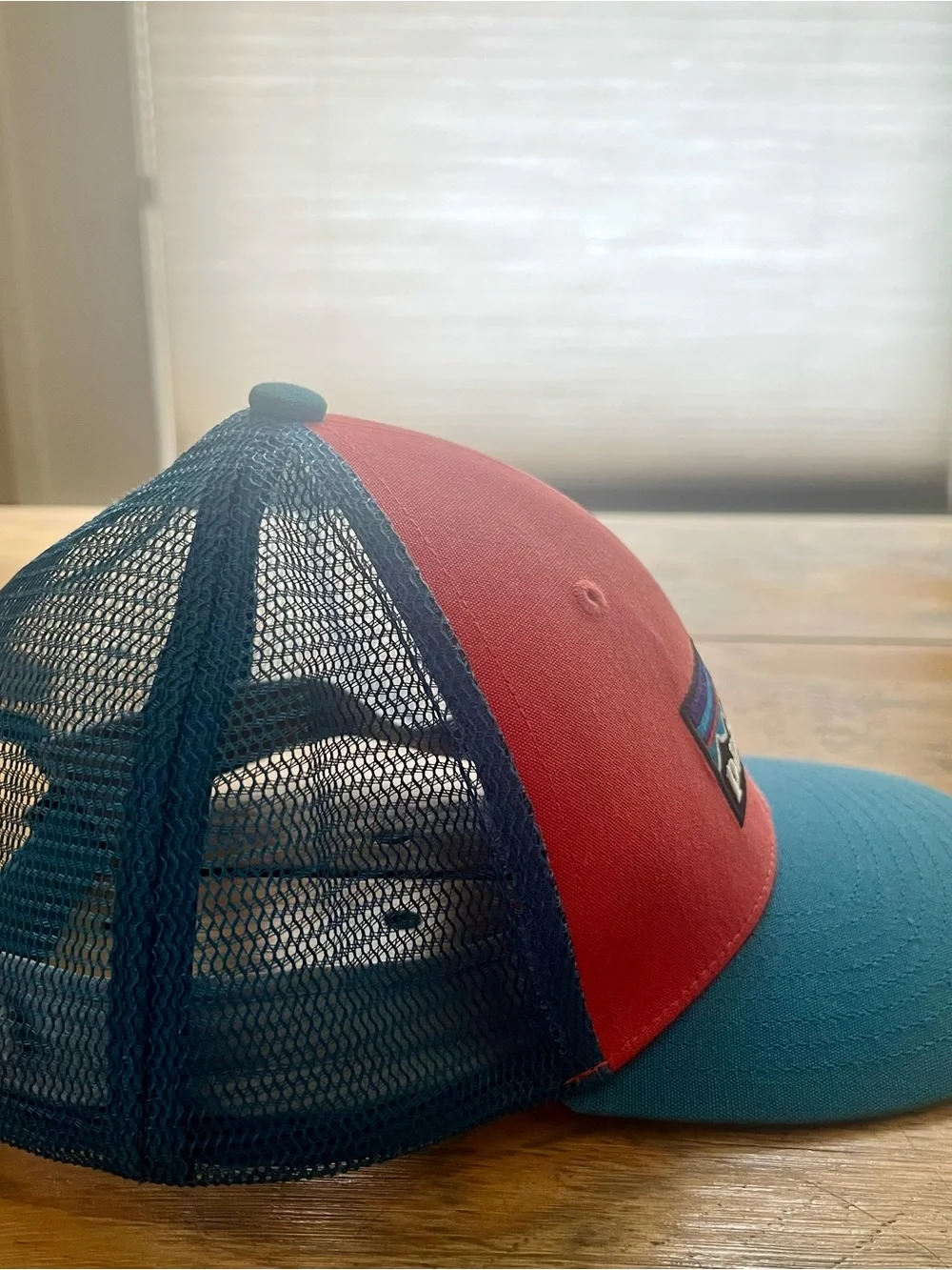 Patagonia women’s Two-Tone Red and Teal Mesh Trucker Hat